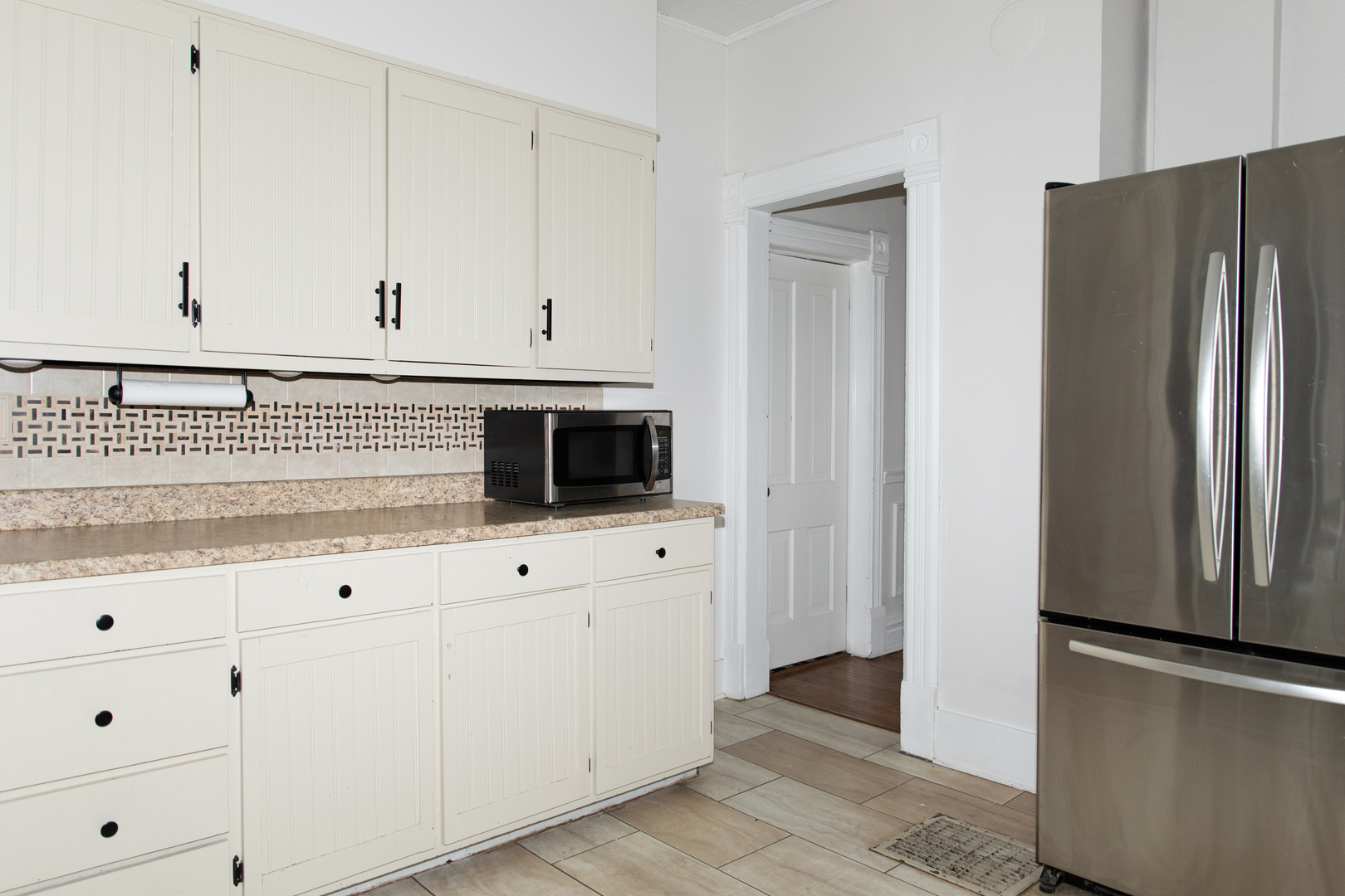 544 24th Avenue Moline, IL 61265 - Photo 10 of 24 a kitchen with stainless steel appliances white cabinets and a refrigerator