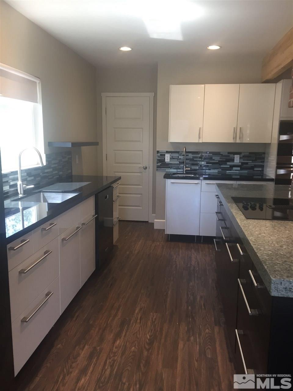 259 West Arroyo Street Reno, NV 89509 - Photo 11 of 24 a kitchen with a sink stove and cabinets