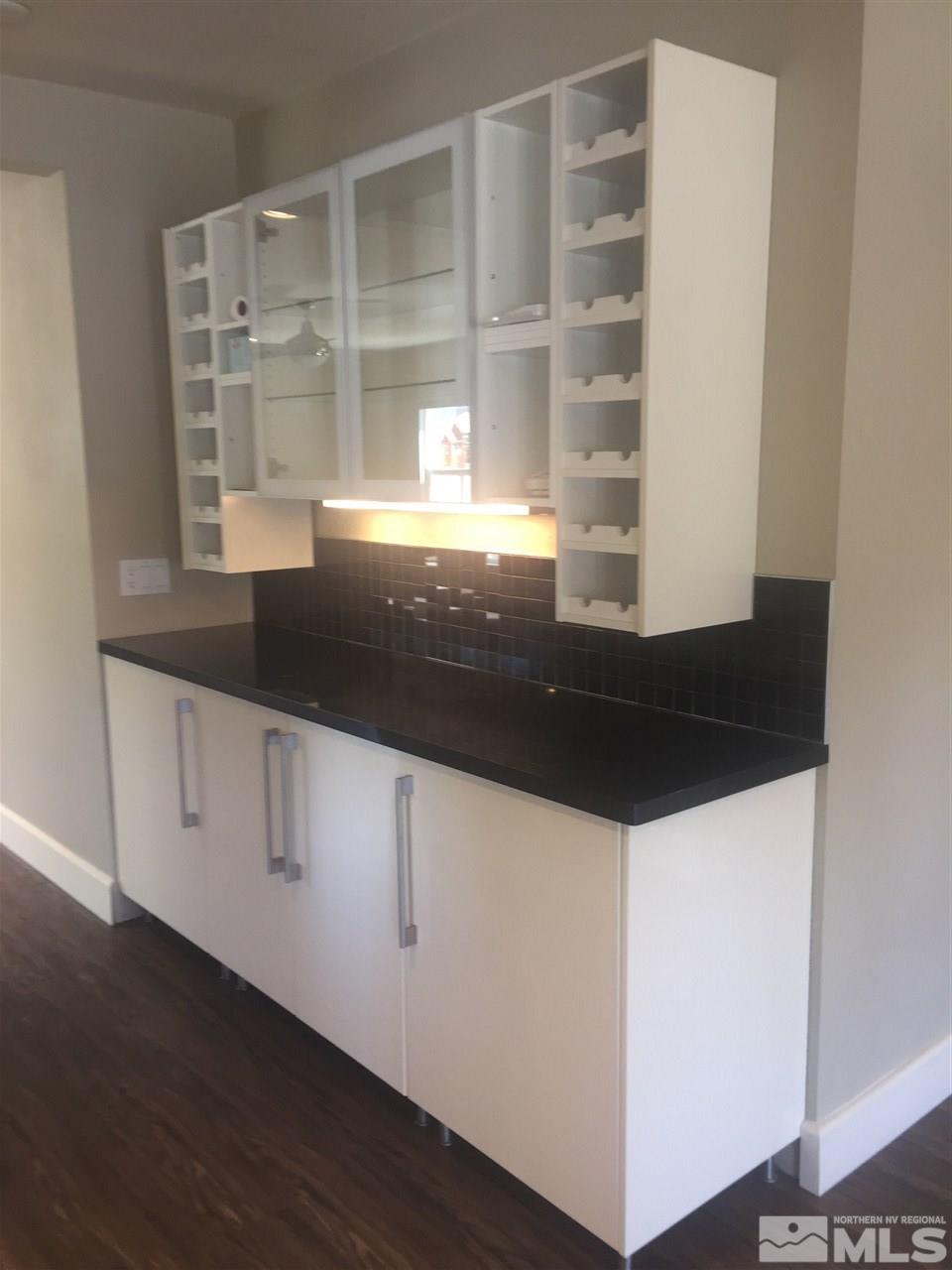 259 West Arroyo Street Reno, NV 89509 - Photo 13 of 24 a kitchen with granite countertop a sink and a window