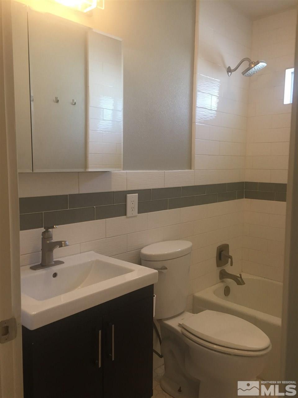 259 West Arroyo Street Reno, NV 89509 - Photo 20 of 24 a bathroom with a sink a toilet and mirror
