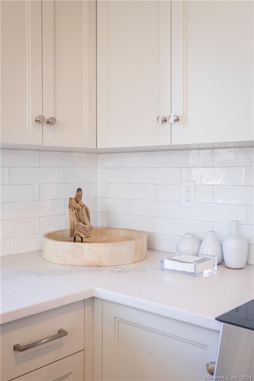 201 Main Street, Unit 203 Westport, CT 06880 - Photo 11 of 40 a kitchen with a sink and cabinets
