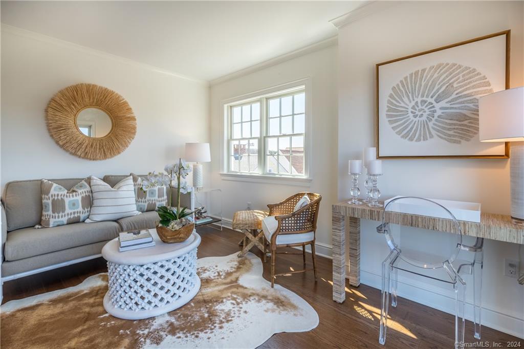 201 Main Street, Unit 203 Westport, CT 06880 - Photo 17 of 40 a living room with furniture a rug and a window