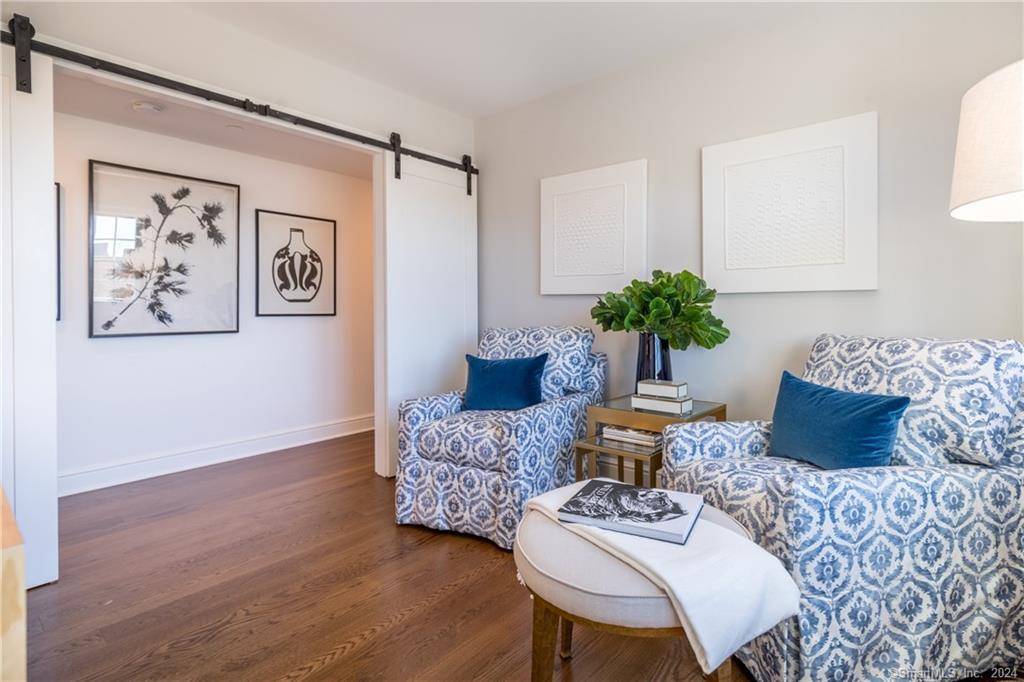 201 Main Street, Unit 203 Westport, CT 06880 - Photo 30 of 40 a living room with furniture and wooden floor