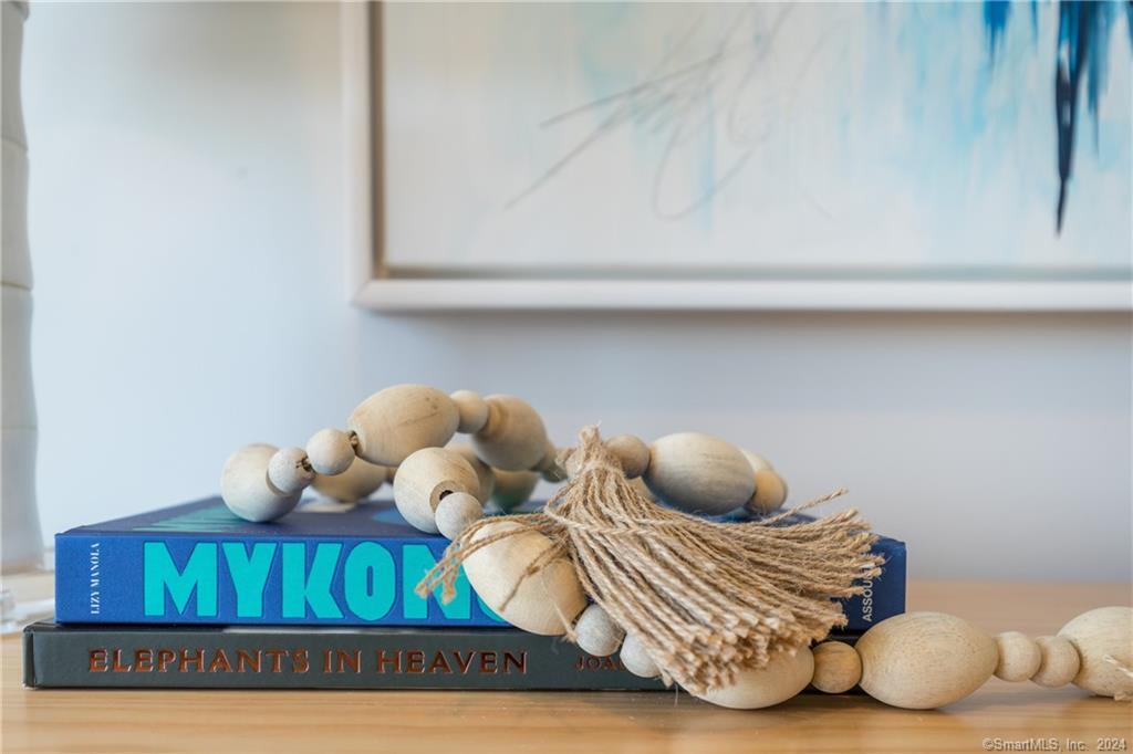 201 Main Street, Unit 203 Westport, CT 06880 - Photo 32 of 40 a bedroom with a bed and cabinets