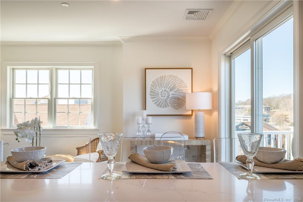 201 Main Street, Unit 203 Westport, CT 06880 - Photo 6 of 40 a room with a large window and furniture
