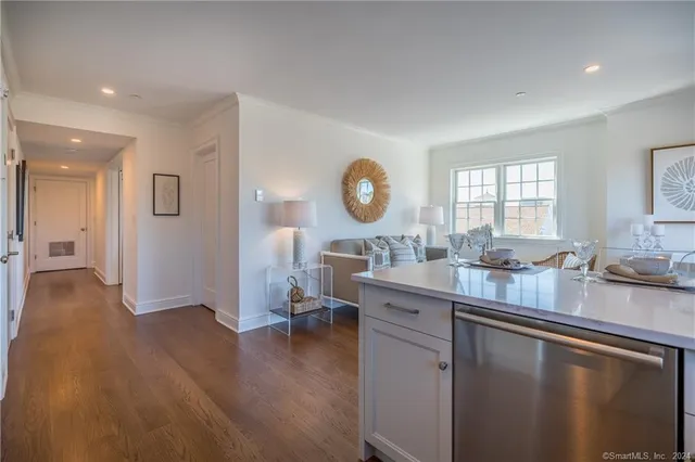 a open kitchen with sink cabinets and wooden floor