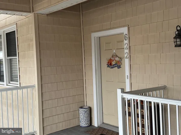 a view of a door and a window