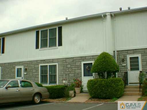 4905 Hana Road Edison, NJ 08817 - Photo 2 of 2 a car parked in front of a building