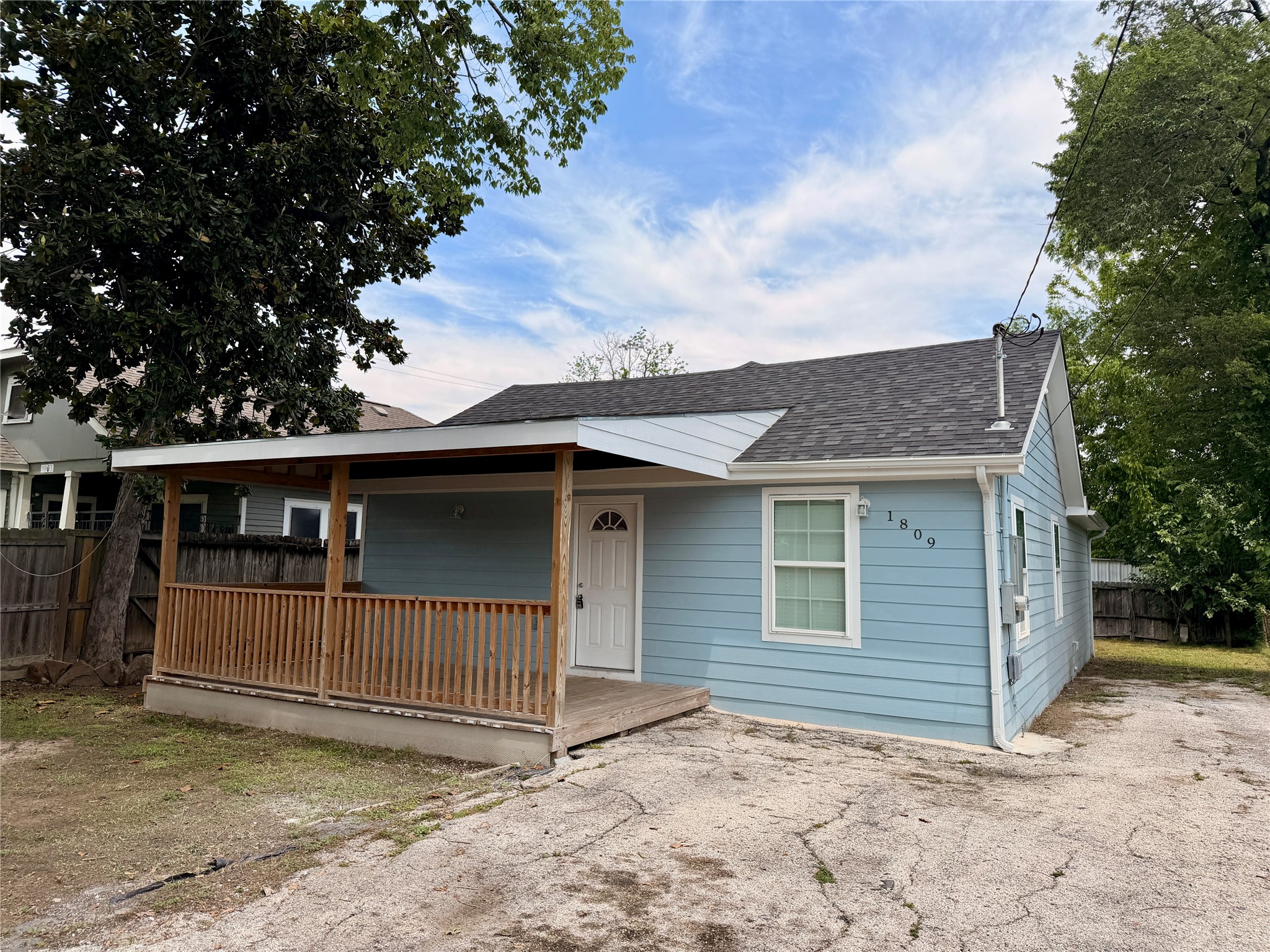 1809 Reese Street Houston, TX 77012 - Photo 1 of 23 a view of a house with a fence and a tree