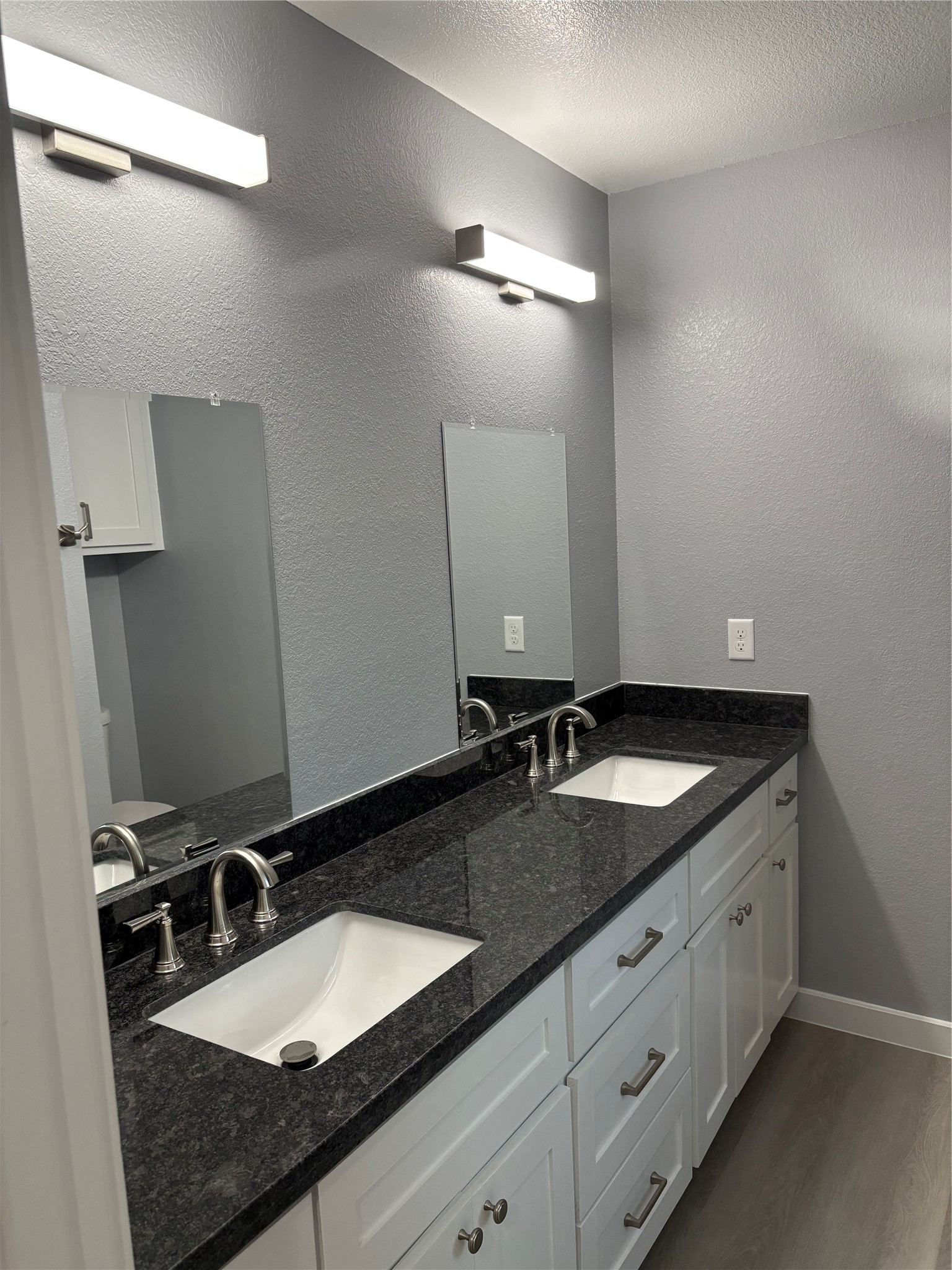 1809 Reese Street Houston, TX 77012 - Photo 11 of 23 a bathroom with a granite countertop sink double and mirror