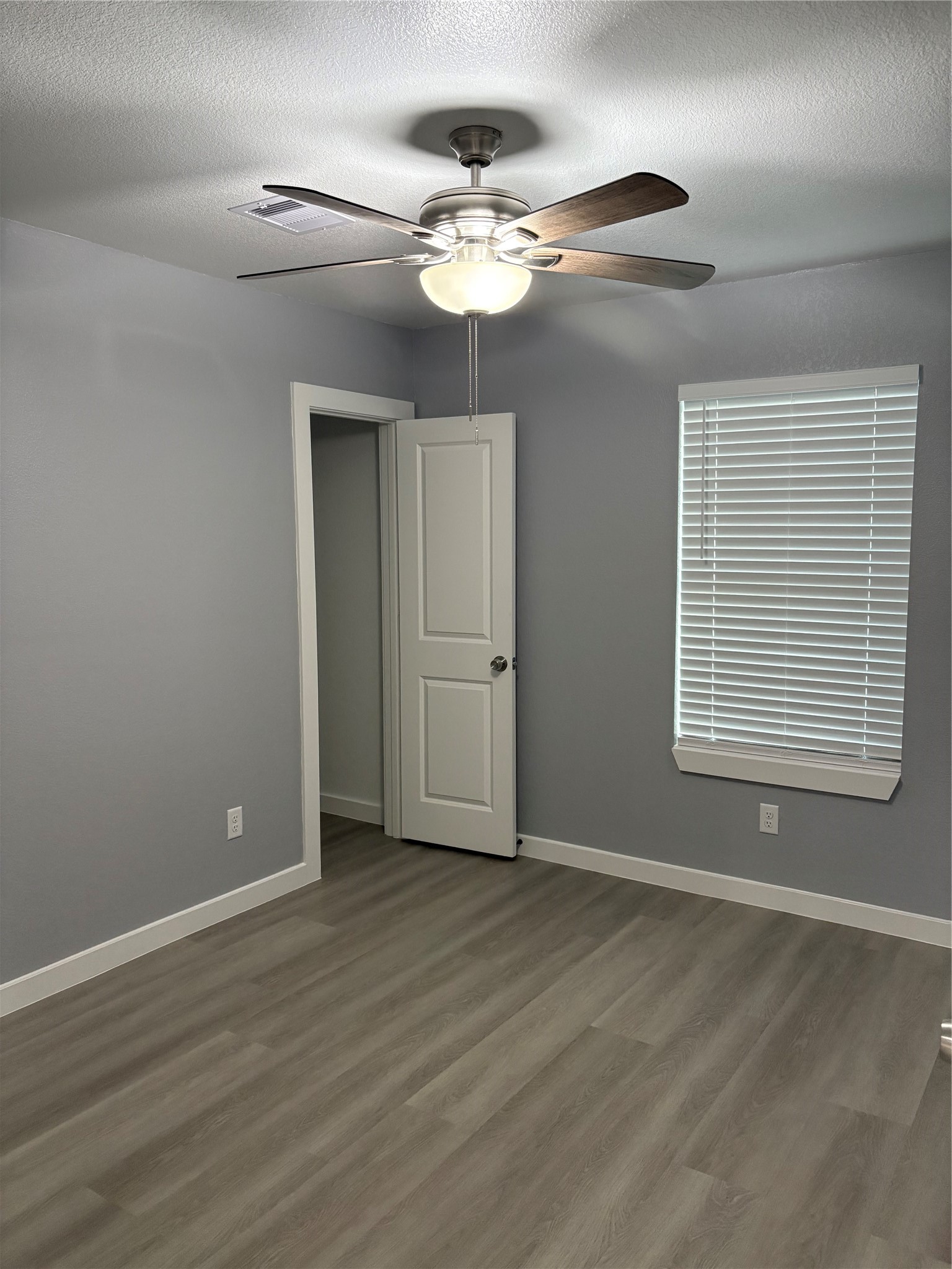 1809 Reese Street Houston, TX 77012 - Photo 18 of 23 a view of an empty room with wooden floor and a window