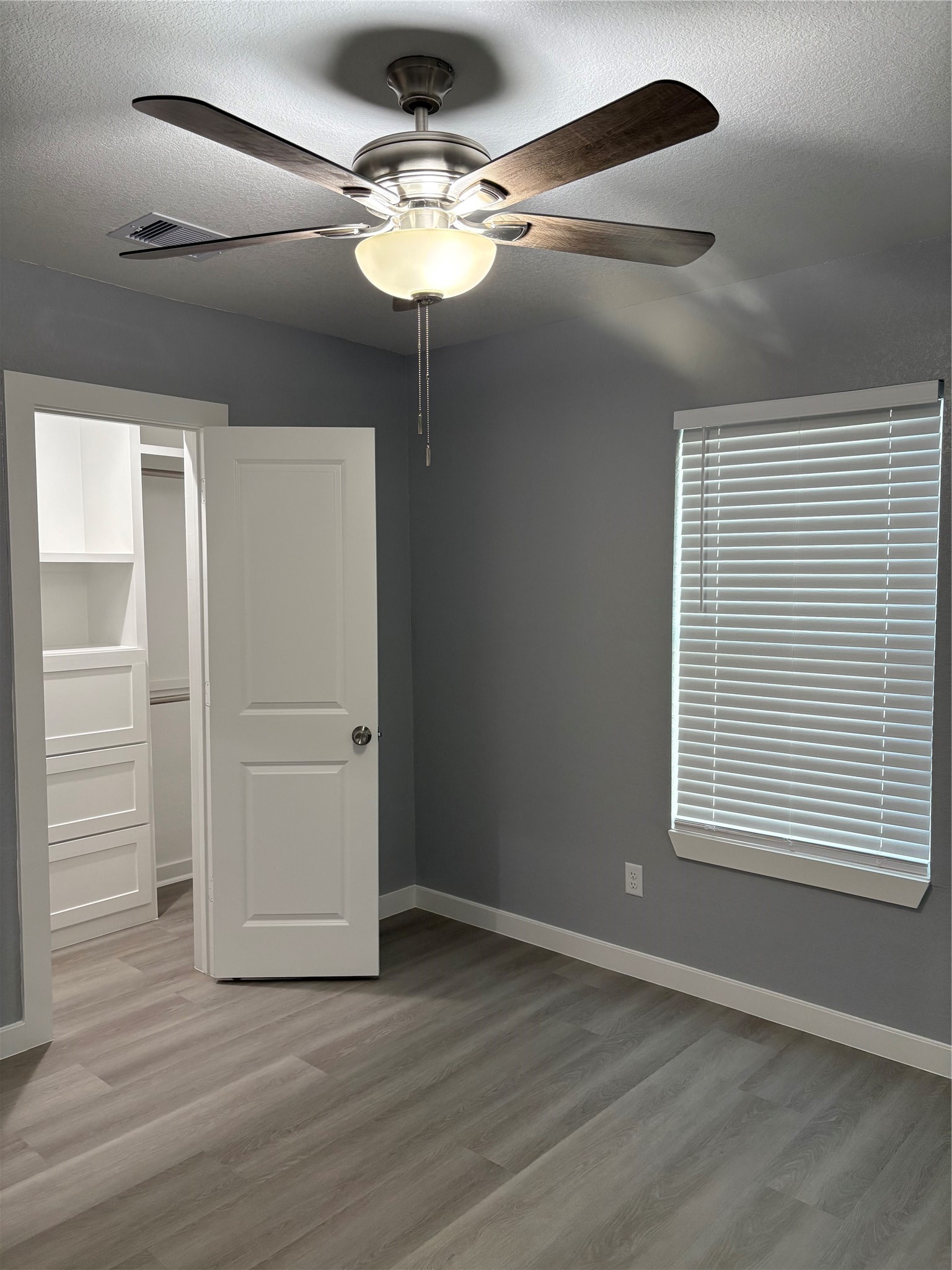 1809 Reese Street Houston, TX 77012 - Photo 19 of 23 a view of an empty room with wooden floor and a window