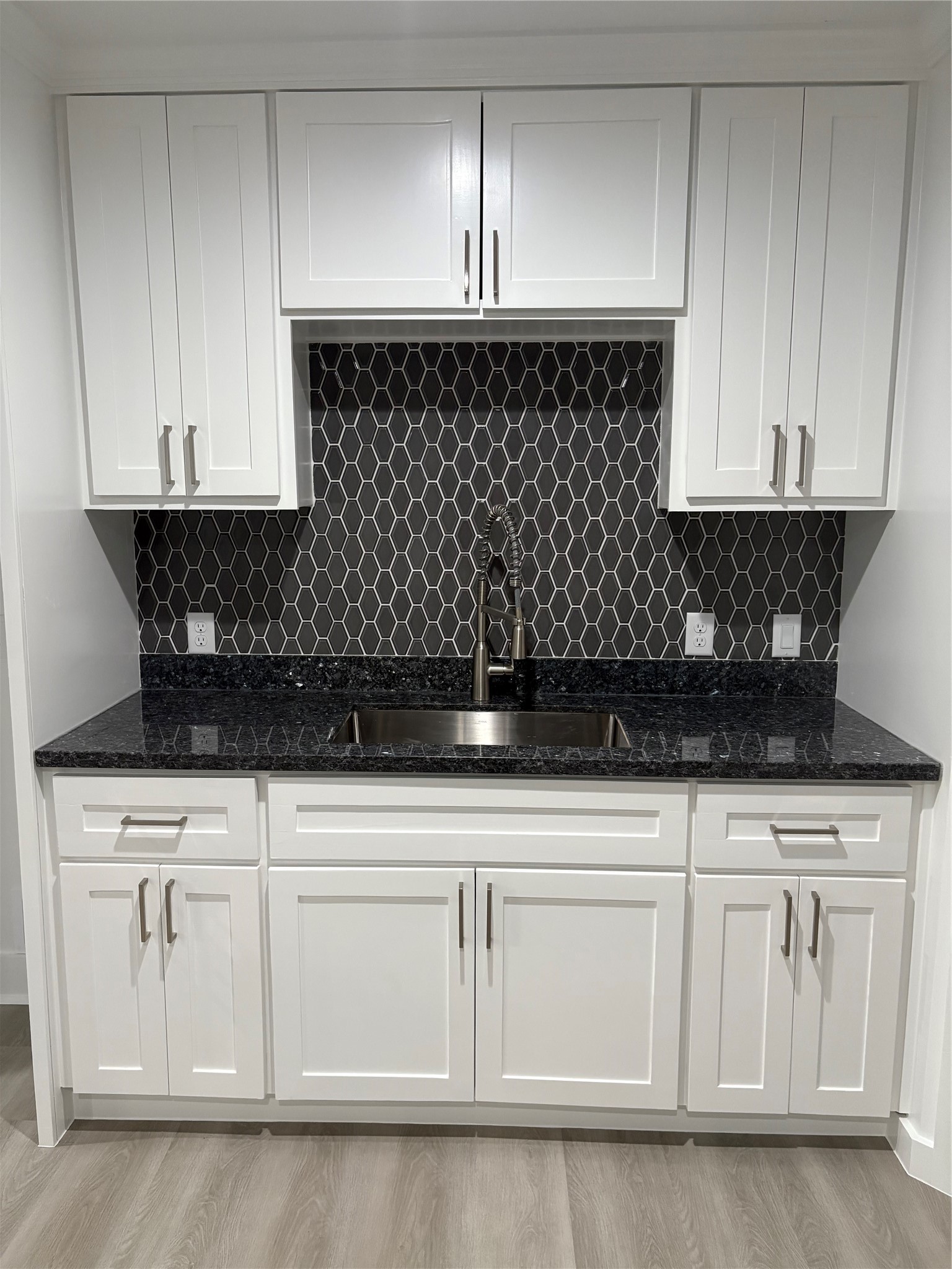 1809 Reese Street Houston, TX 77012 - Photo 6 of 23 a kitchen with white cabinets