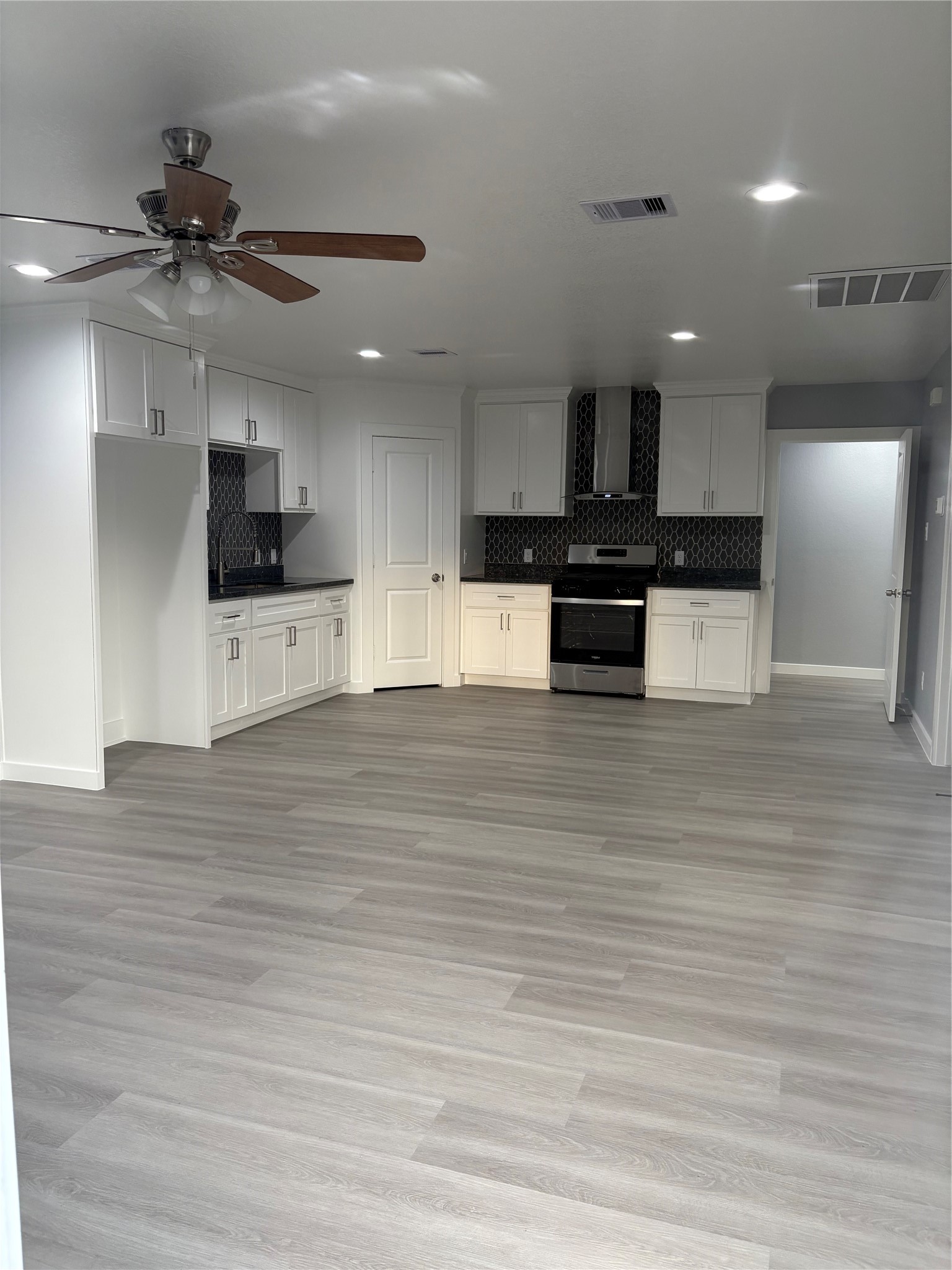 1809 Reese Street Houston, TX 77012 - Photo 7 of 23 a view of kitchen with refrigerator stove and microwave