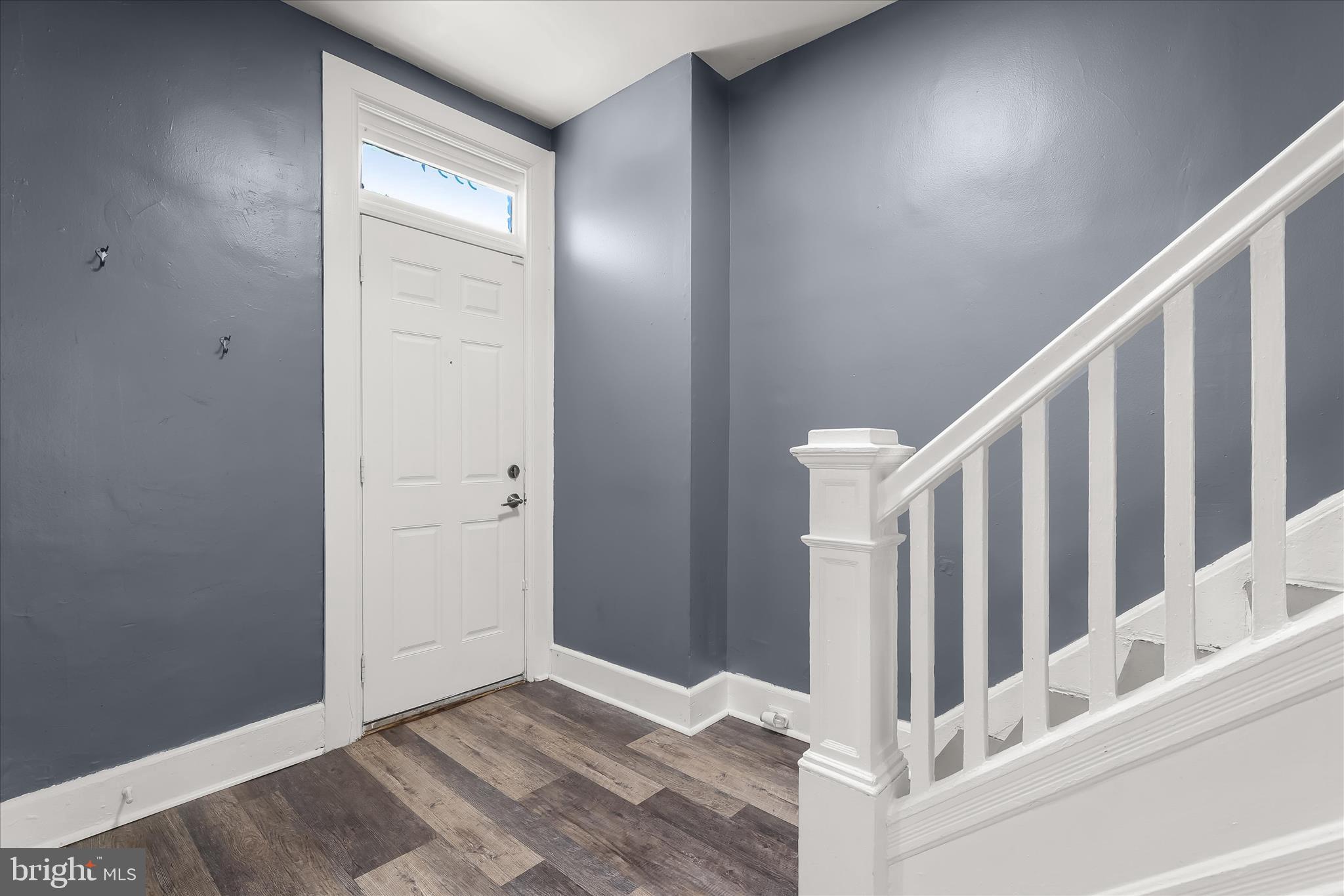 3534 Overview Road Baltimore, MD 21215 - Photo 5 of 28 a view of staircase with white walls and white door
