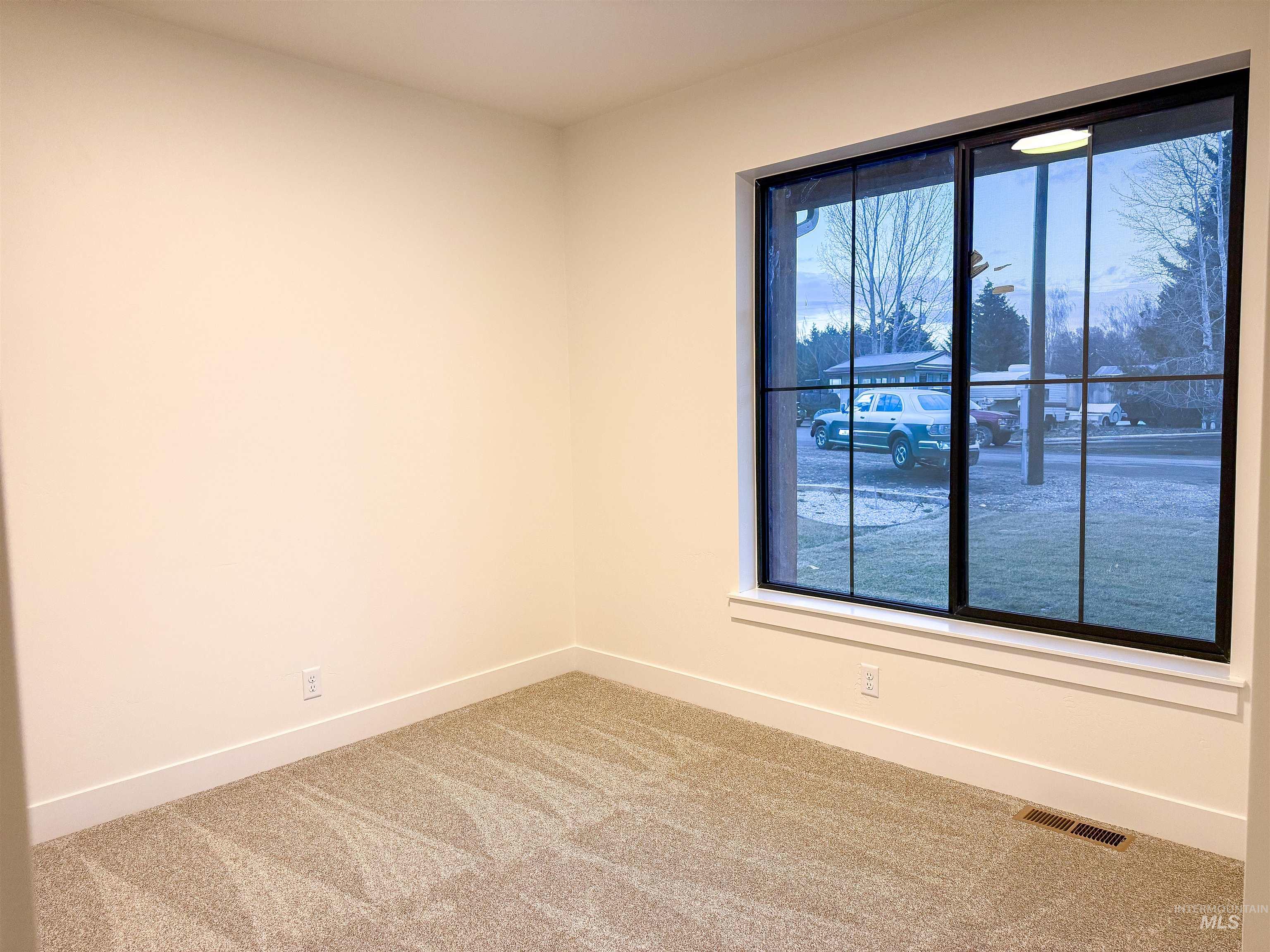 245 Whitman Street Albion, ID 83311 - Photo 7 of 15 Carpeted spare room with baseboards