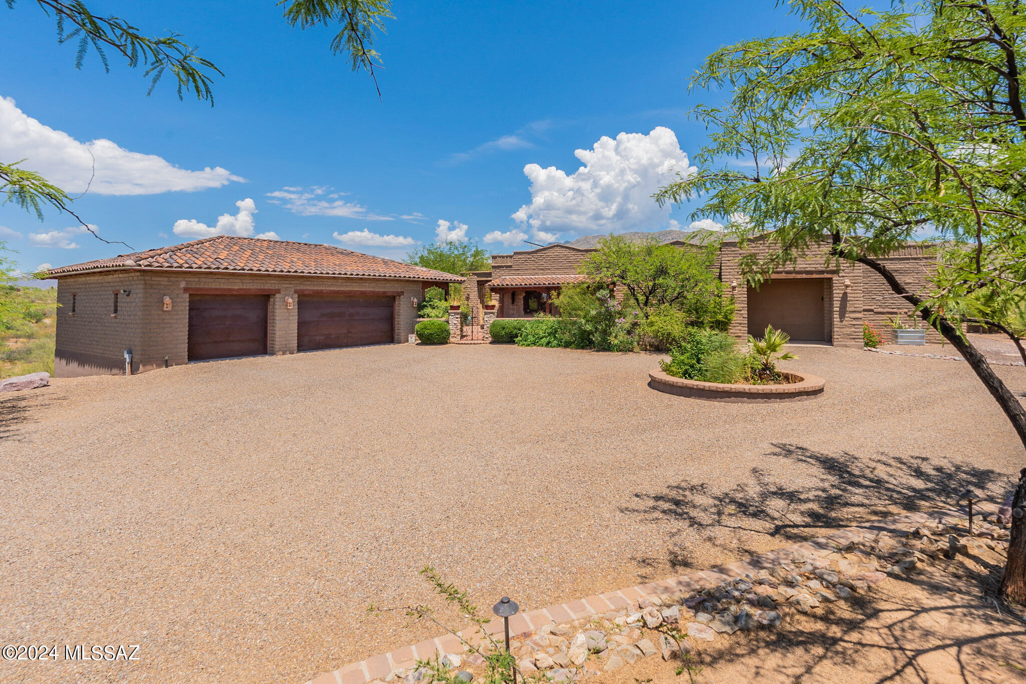 11725 East Spanish Ridge Place Tucson, AZ 85730 - Photo 6 of 51 a view of a white house with a yard