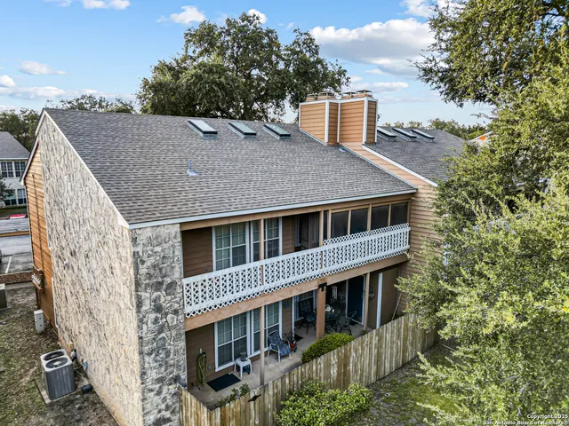 a aerial view of a house with a yard