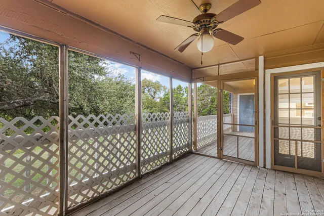 a view of a room window and wooden floor
