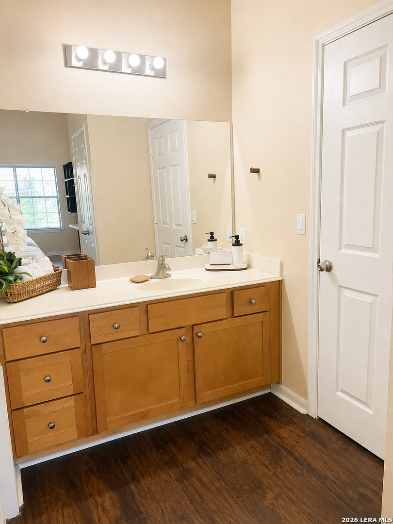 6160 Eckhert Road, Unit 804 San Antonio, TX 78240 - Photo 16 of 38 a spacious bathroom with a double vanity sink and mirror