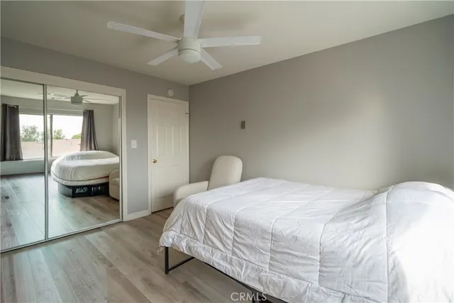 a bedroom with a bed and a couch