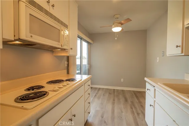 a kitchen with a stove and a microwave