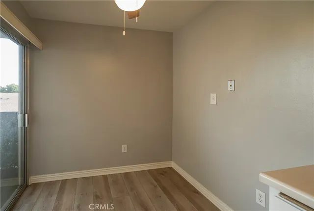 a spacious bedroom with a bed and a chair