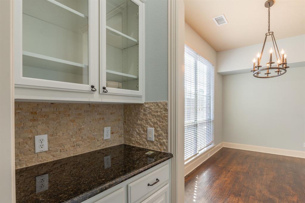 11775 Frontier Drive Frisco, TX 75033 - Photo 12 of 40 a bathroom with a granite countertop sink a window and a mirror