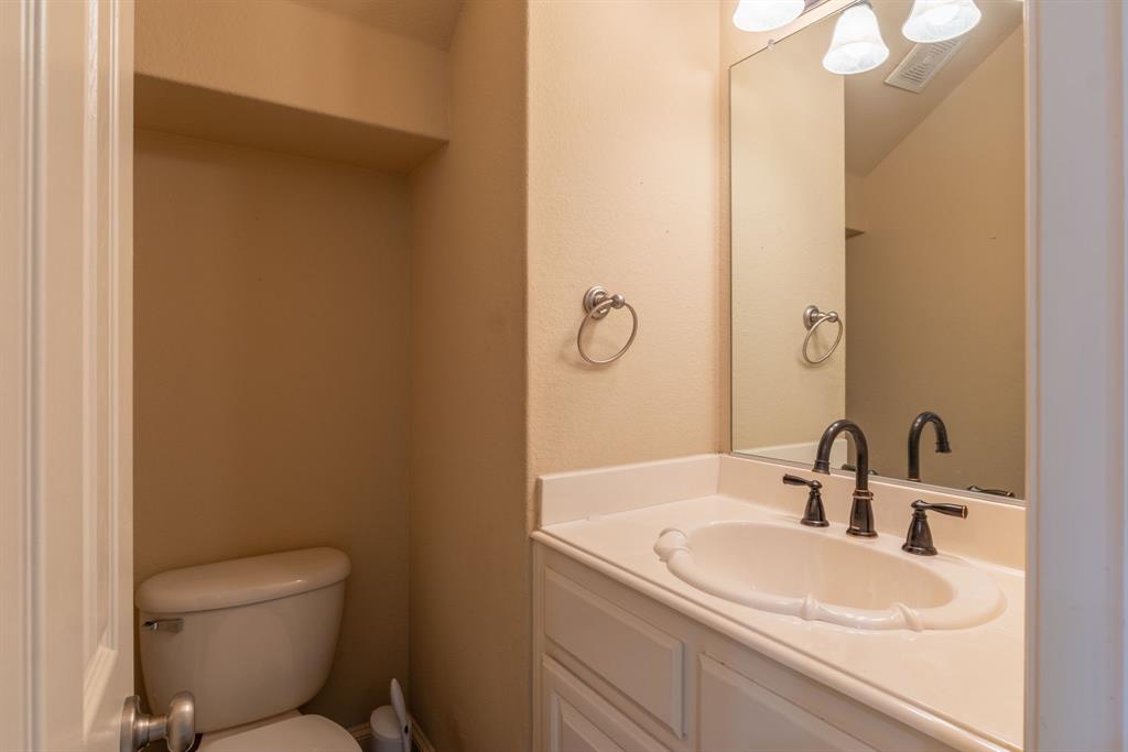 11775 Frontier Drive Frisco, TX 75033 - Photo 13 of 40 a bathroom with a sink toilet and mirror