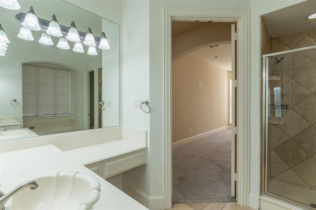 11775 Frontier Drive Frisco, TX 75033 - Photo 20 of 40 a bathroom with a sink vanity and mirror