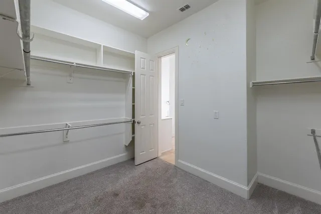a view of an empty walk in closet