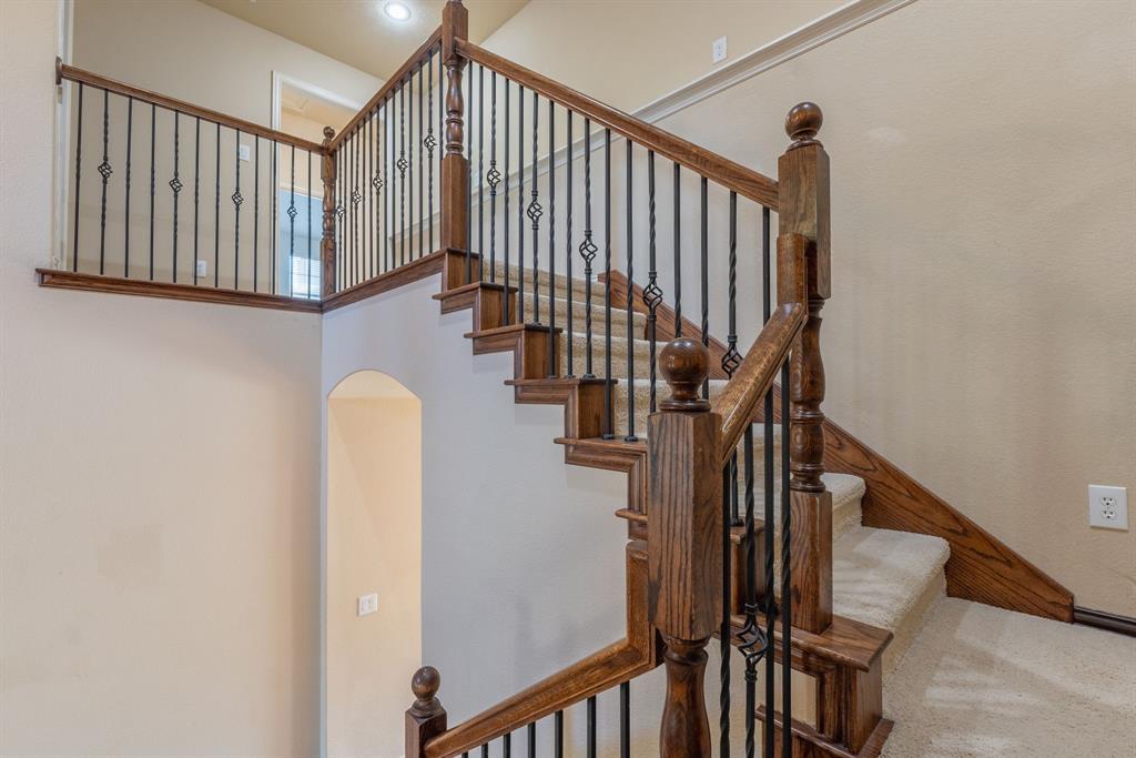 11775 Frontier Drive Frisco, TX 75033 - Photo 23 of 40 a view of staircase with railing and white walls
