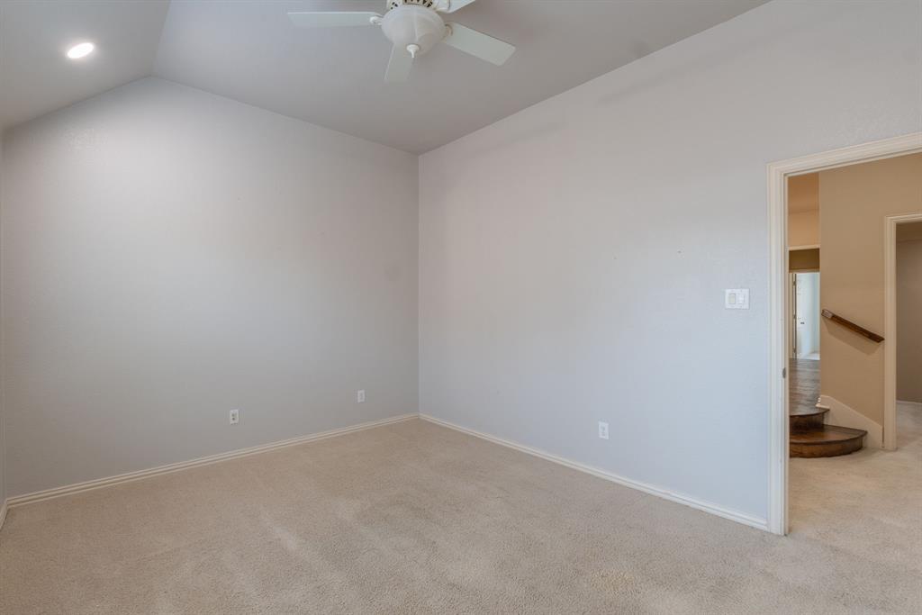 11775 Frontier Drive Frisco, TX 75033 - Photo 32 of 40 an empty room with a ceiling fan and bathroom