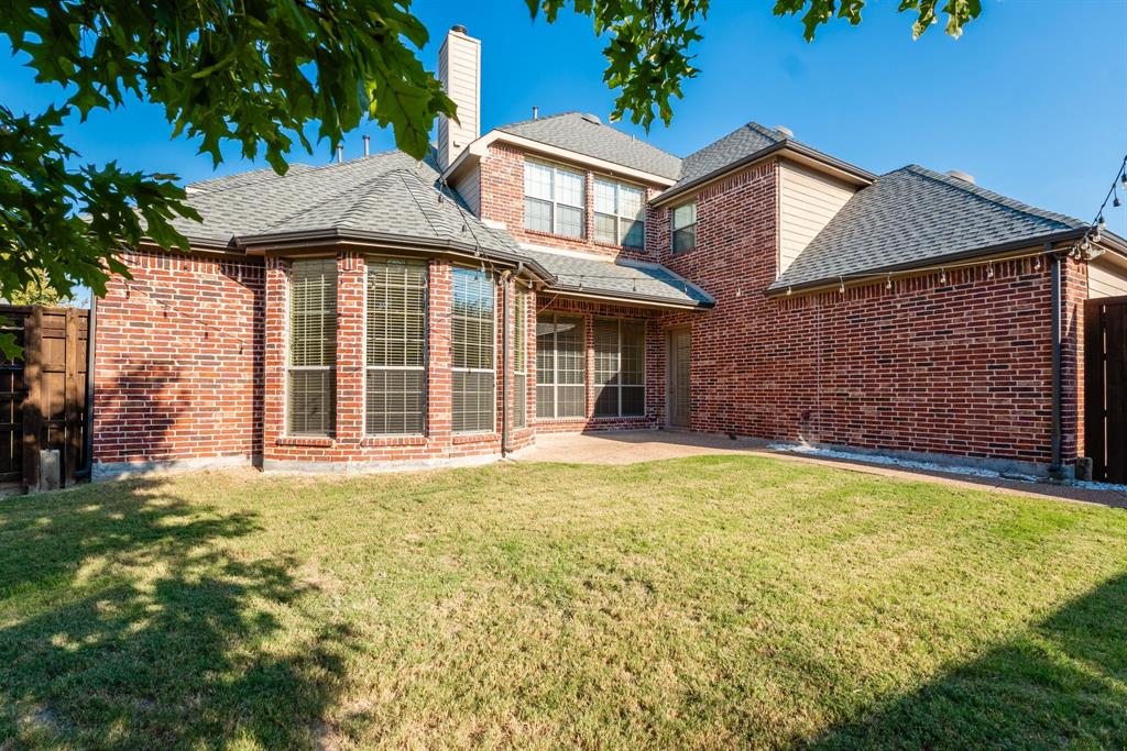 11775 Frontier Drive Frisco, TX 75033 - Photo 37 of 40 a front view of a house with a garden