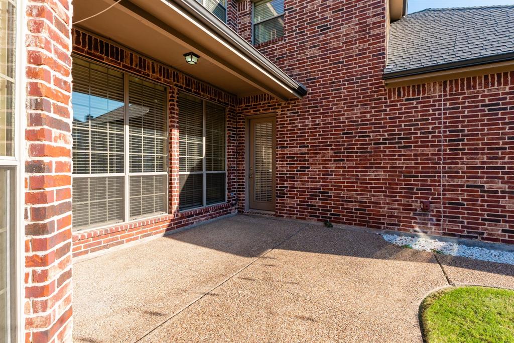 11775 Frontier Drive Frisco, TX 75033 - Photo 39 of 40 a view of a backyard with door