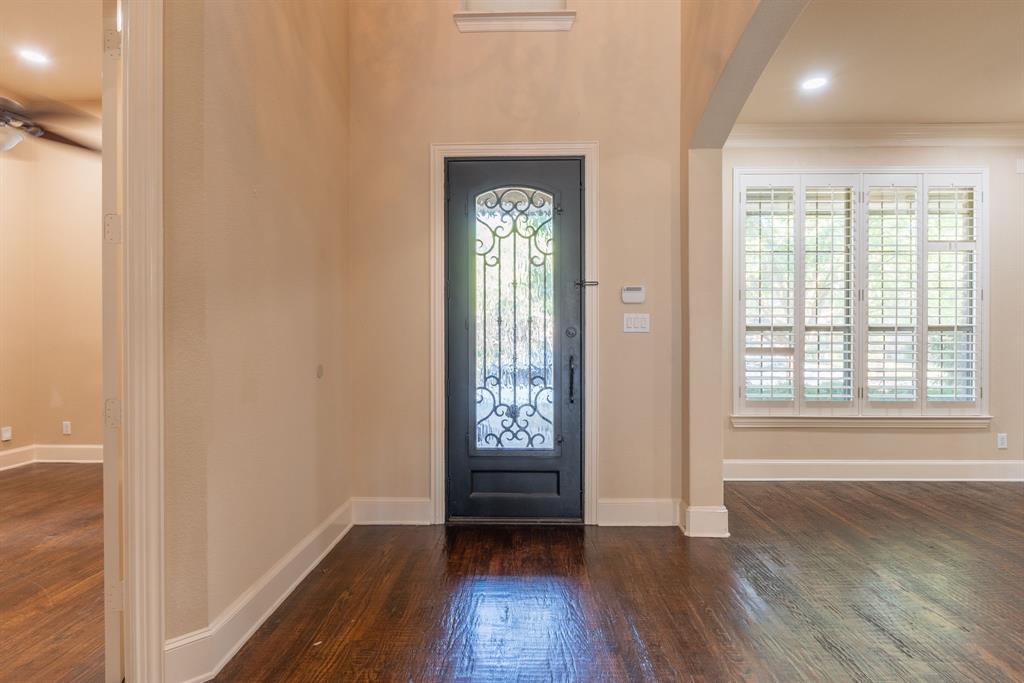11775 Frontier Drive Frisco, TX 75033 - Photo 4 of 40 an empty room with wooden floor and windows