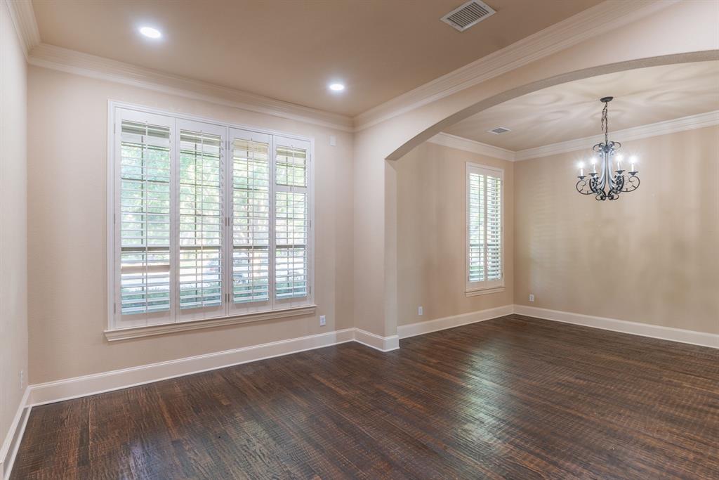 11775 Frontier Drive Frisco, TX 75033 - Photo 6 of 40 a view of an empty room with wooden floor and a window