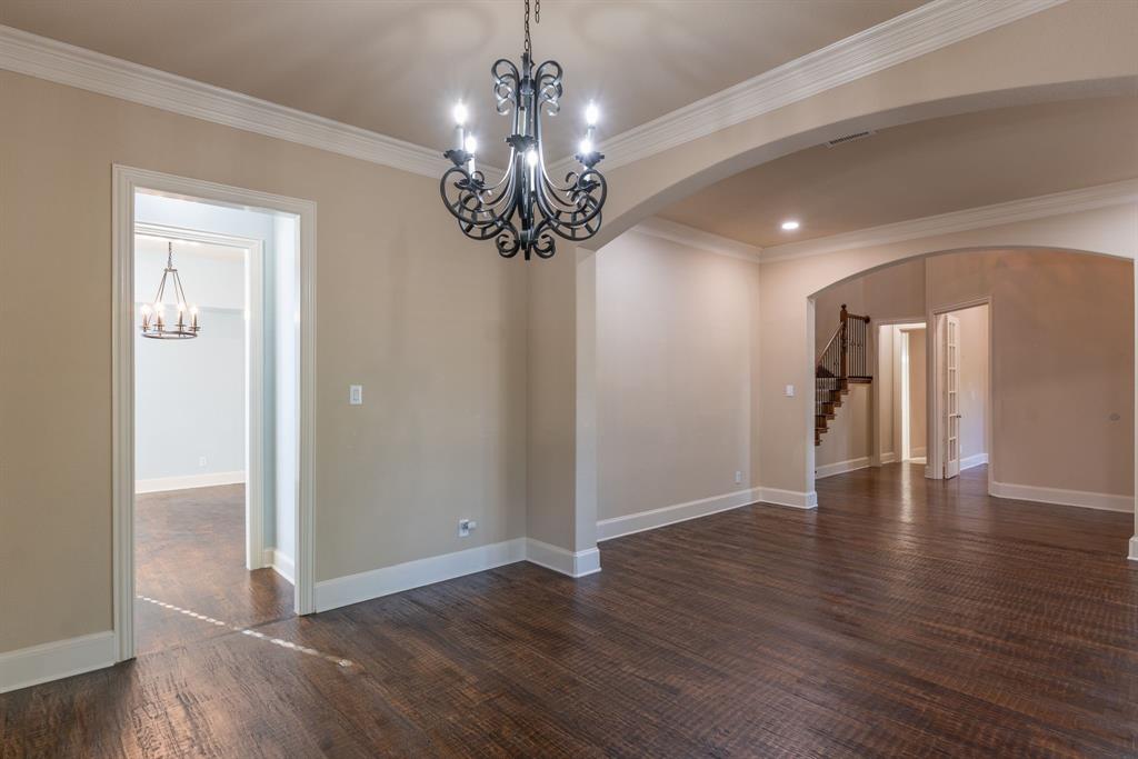 11775 Frontier Drive Frisco, TX 75033 - Photo 7 of 40 a view of a room with wooden floor chandelier and window