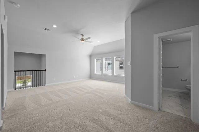 a view of an empty room and window and wooden floor