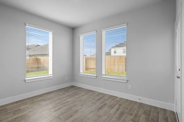 a view of kitchen with furniture and refrigerator
