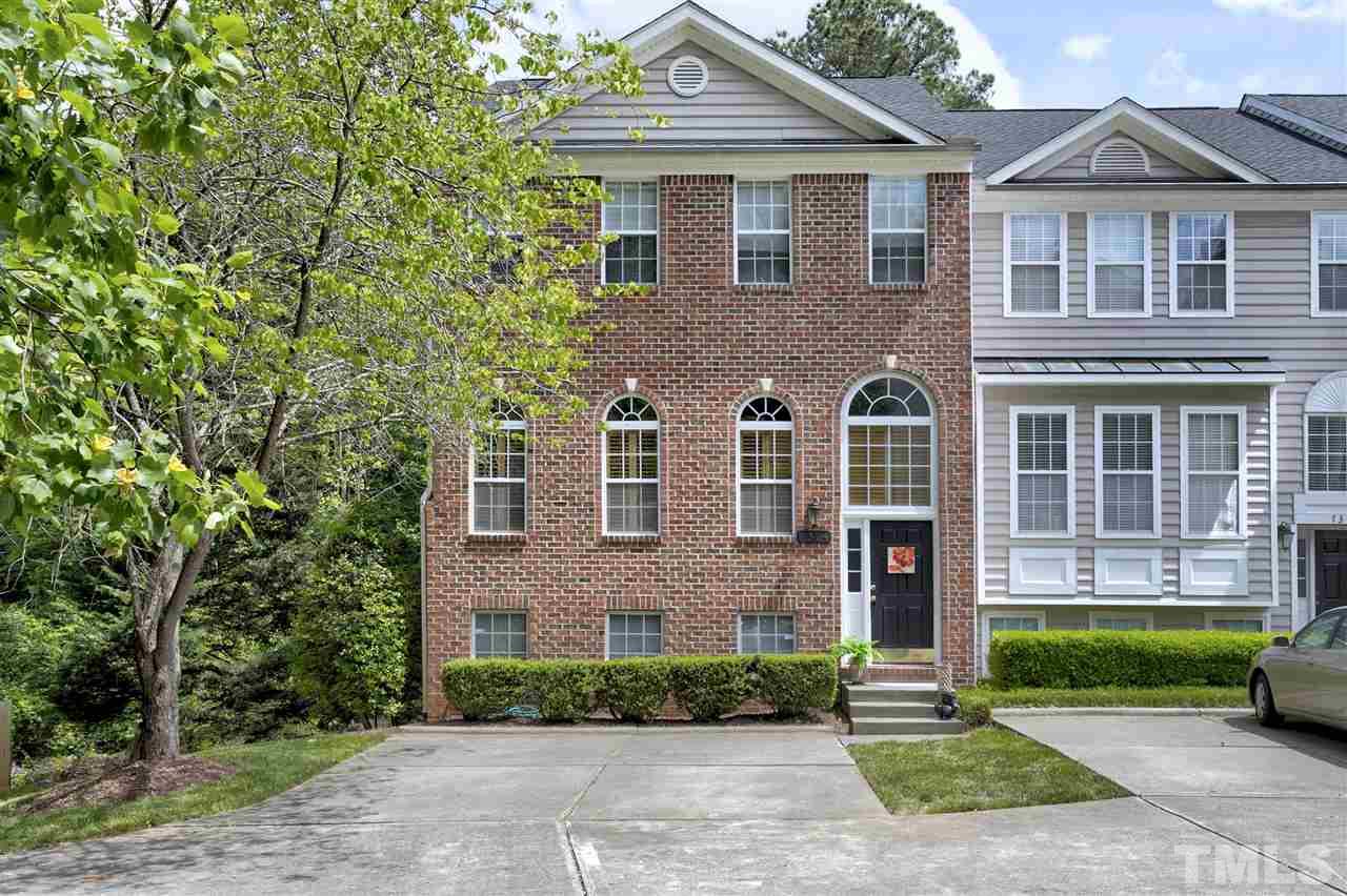 7314 Doverton Court Raleigh, NC 27615 - Photo 2 of 30 a front view of a house with a yard