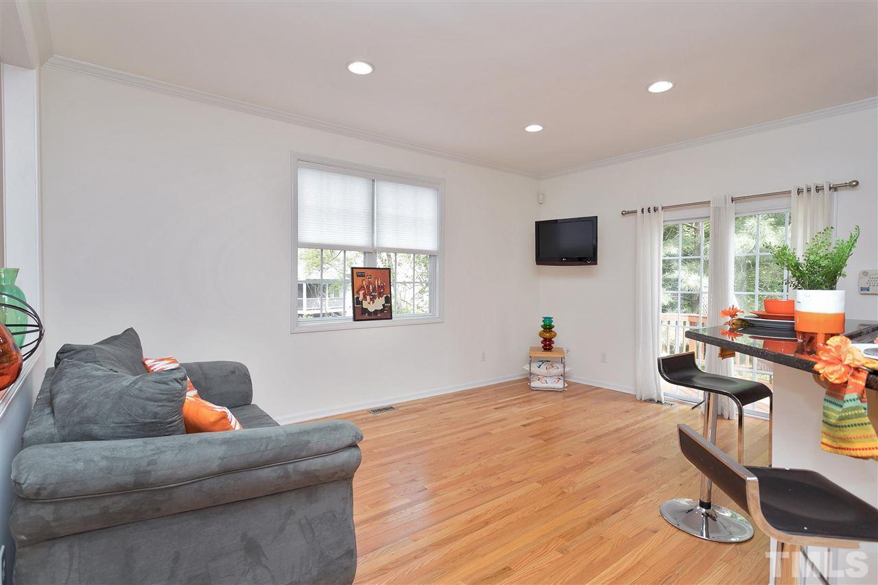 7314 Doverton Court Raleigh, NC 27615 - Photo 11 of 30 a bedroom with furniture and a wooden floor