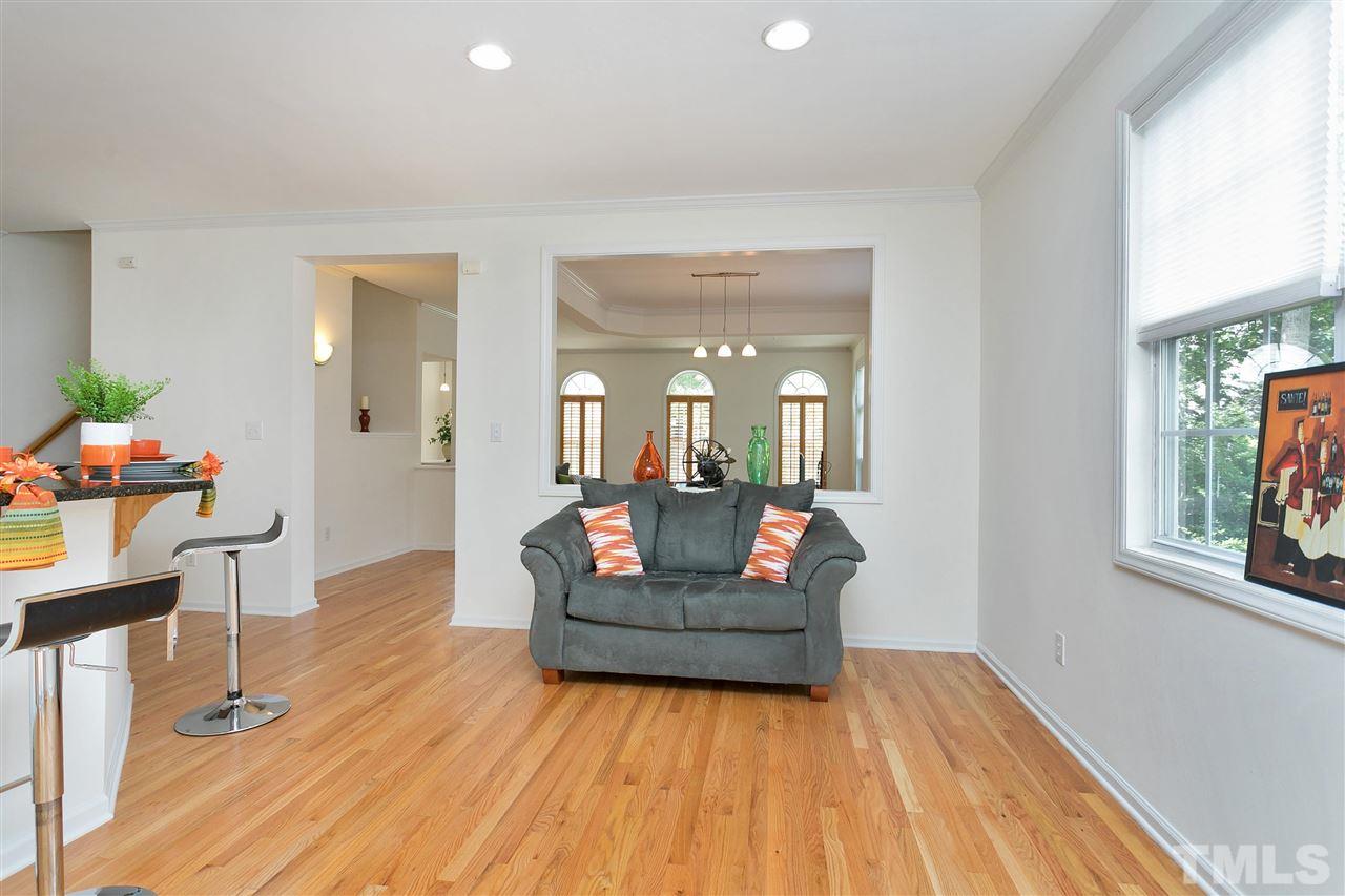 7314 Doverton Court Raleigh, NC 27615 - Photo 12 of 30 a living room with furniture and a wooden floor
