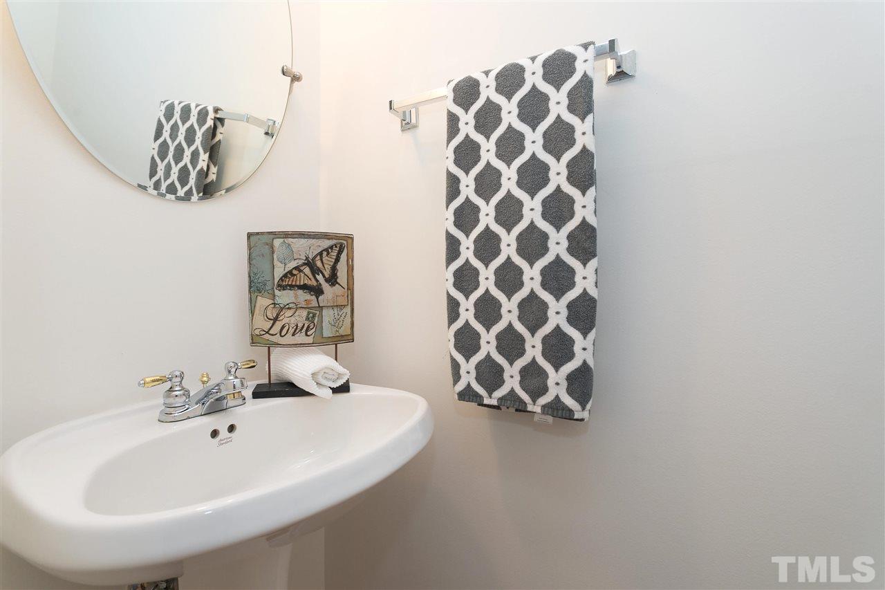 7314 Doverton Court Raleigh, NC 27615 - Photo 13 of 30 a bathroom with a sink and mirror