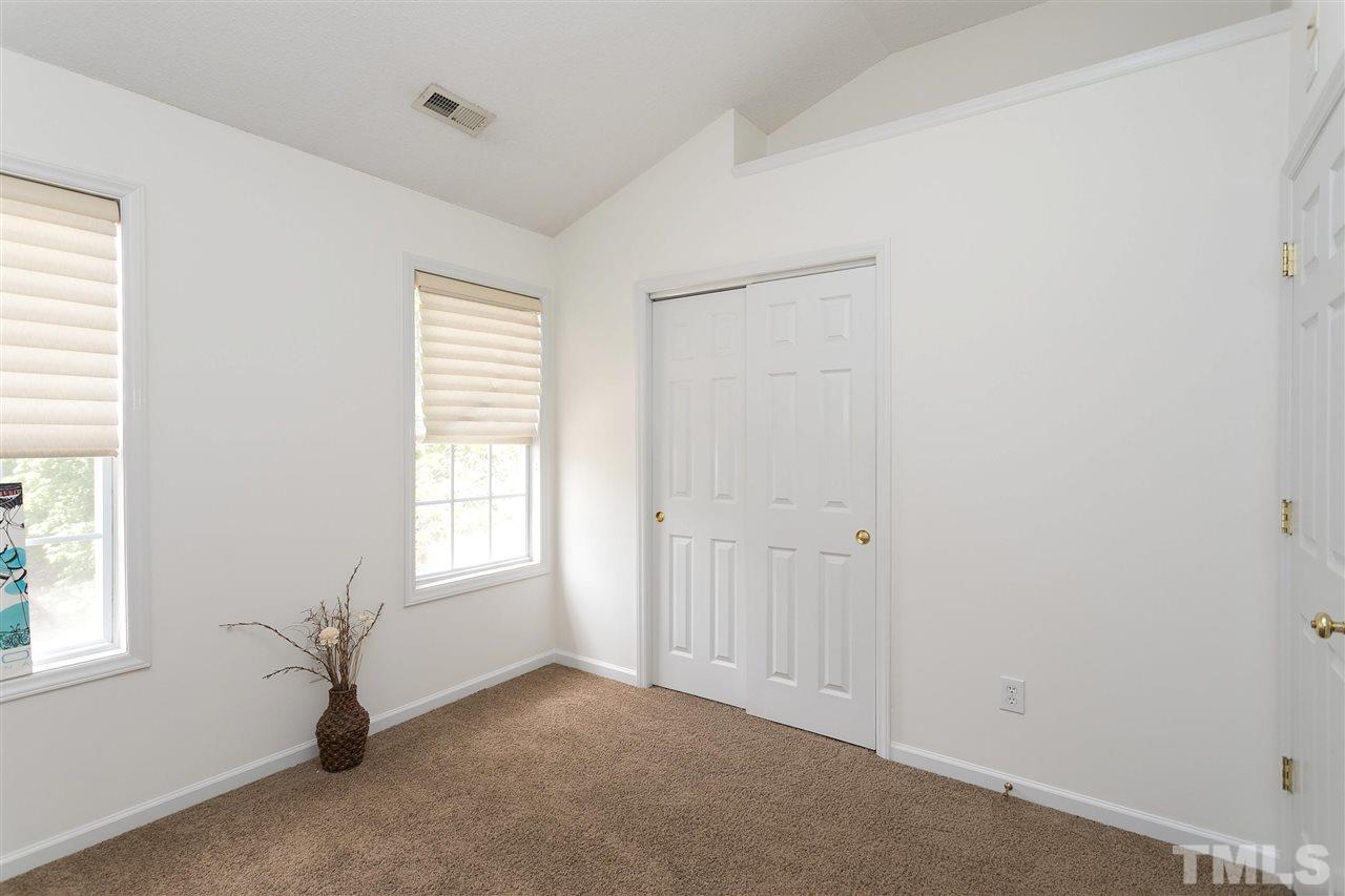 7314 Doverton Court Raleigh, NC 27615 - Photo 20 of 30 an empty room with windows