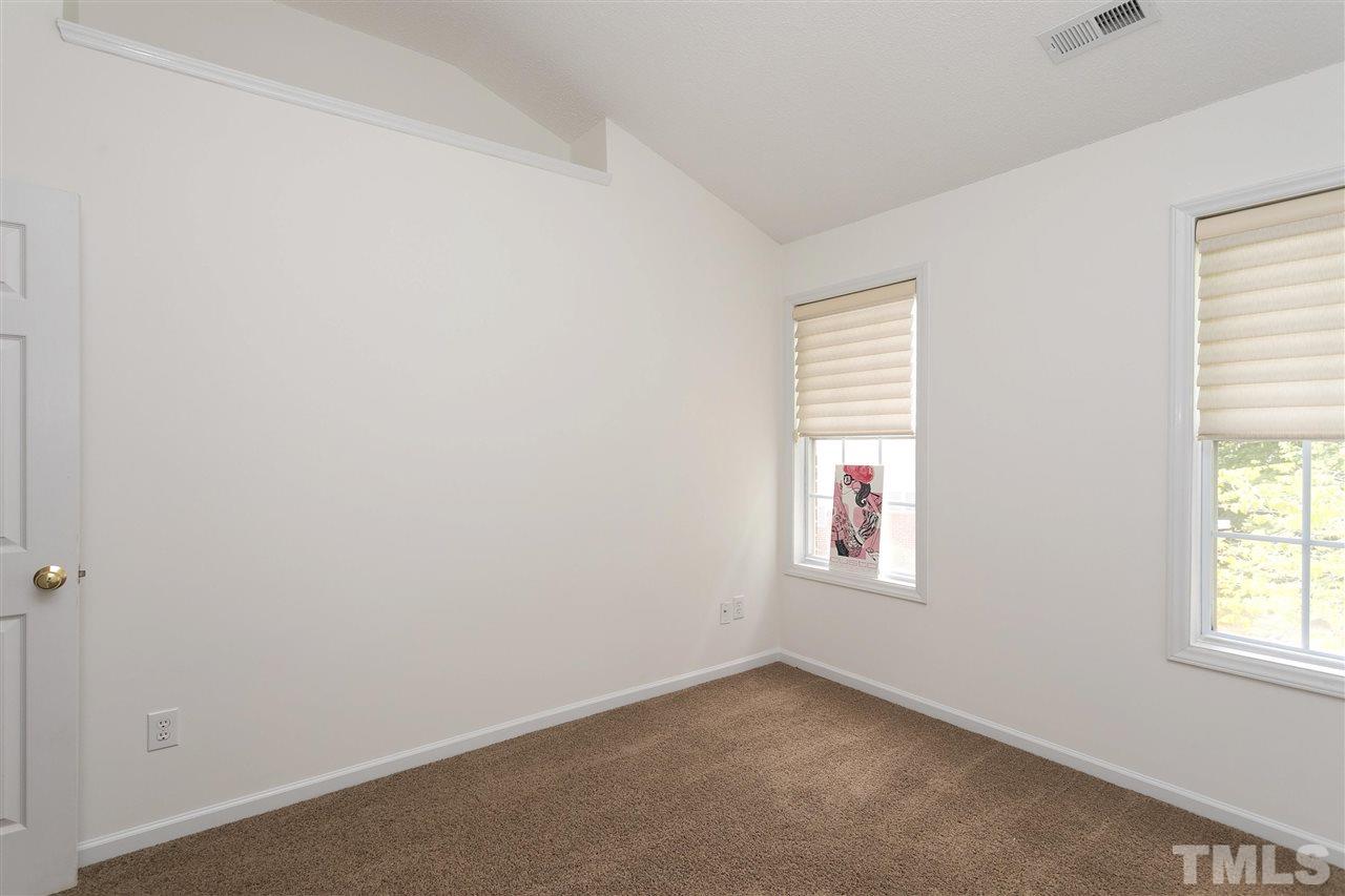 7314 Doverton Court Raleigh, NC 27615 - Photo 21 of 30 an empty room with windows