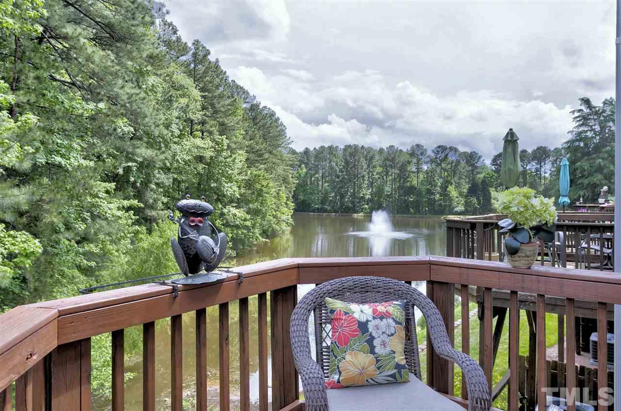 7314 Doverton Court Raleigh, NC 27615 - Photo 29 of 30 a view of a balcony with lake view