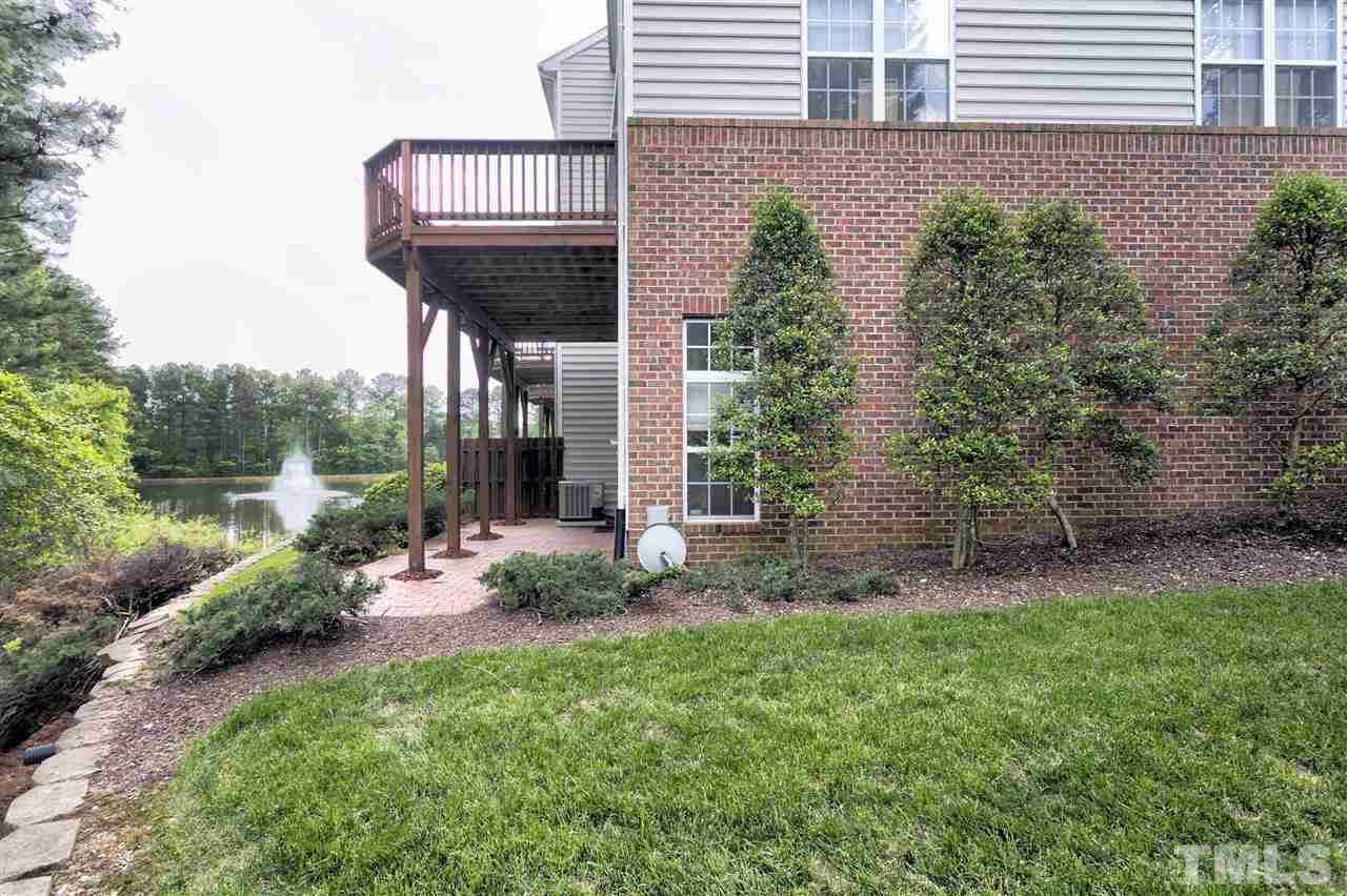 7314 Doverton Court Raleigh, NC 27615 - Photo 30 of 30 a view of a house with a yard and plants