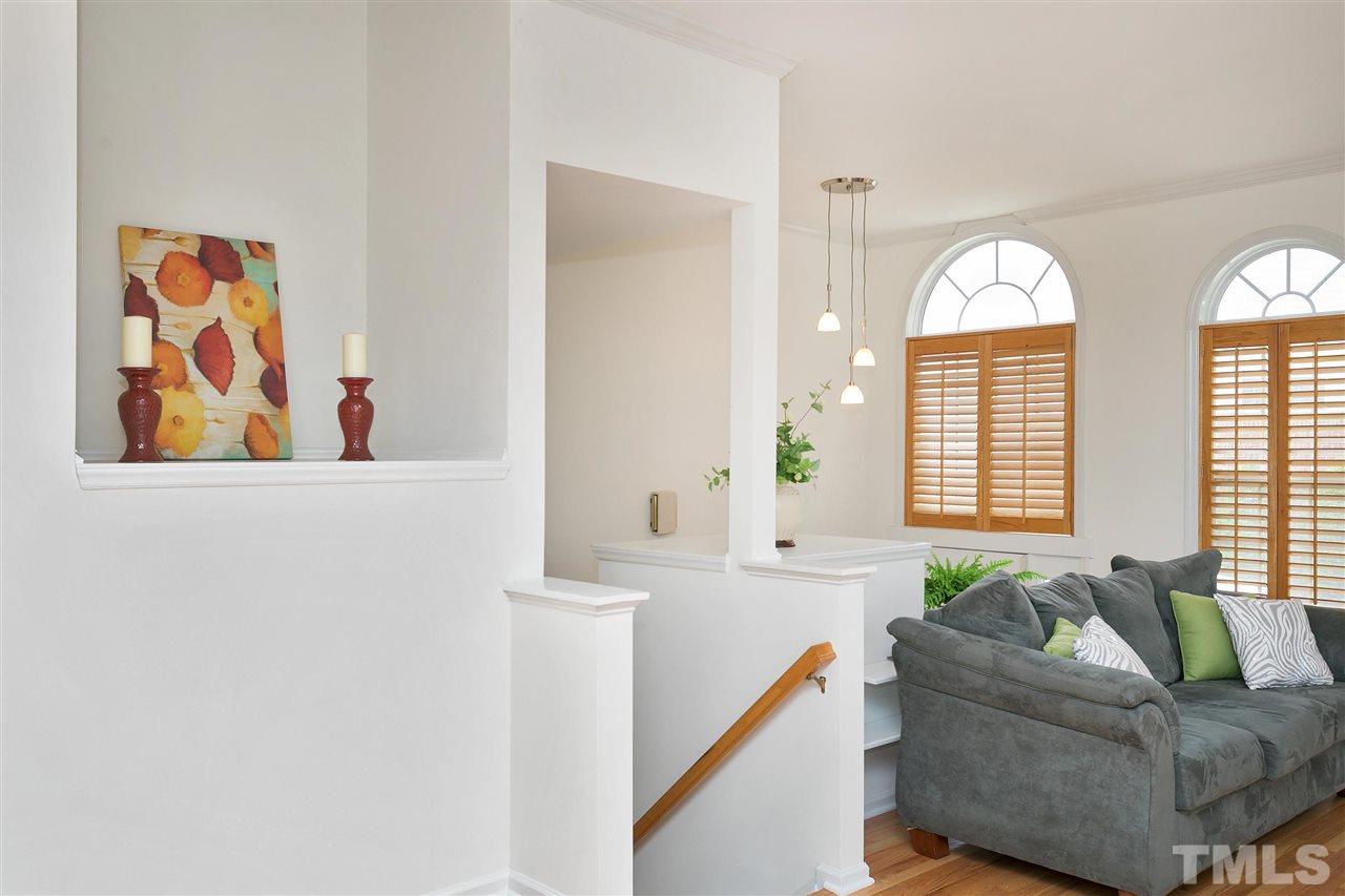 7314 Doverton Court Raleigh, NC 27615 - Photo 6 of 30 a living room with furniture and a large window