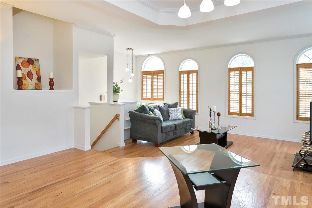 7314 Doverton Court Raleigh, NC 27615 - Photo 8 of 30 a living room with furniture and a hard wood floor